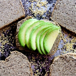 avocado slices on top of a slice of chia millet bread