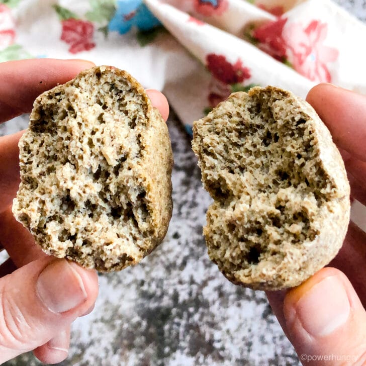 a chia oat roll being town into two pieces
