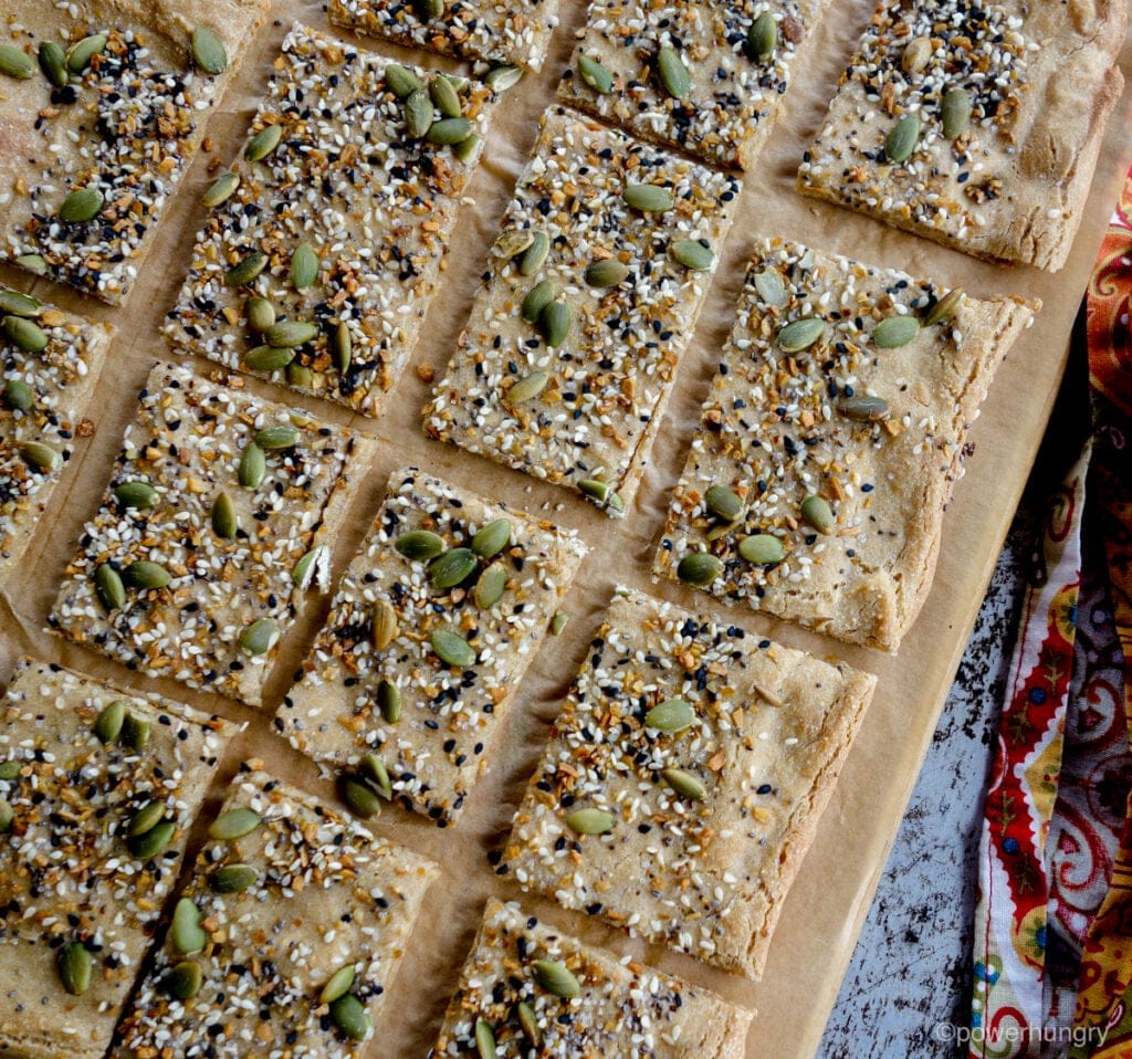 overhead shot of amaranth flatbread, topped with seeds