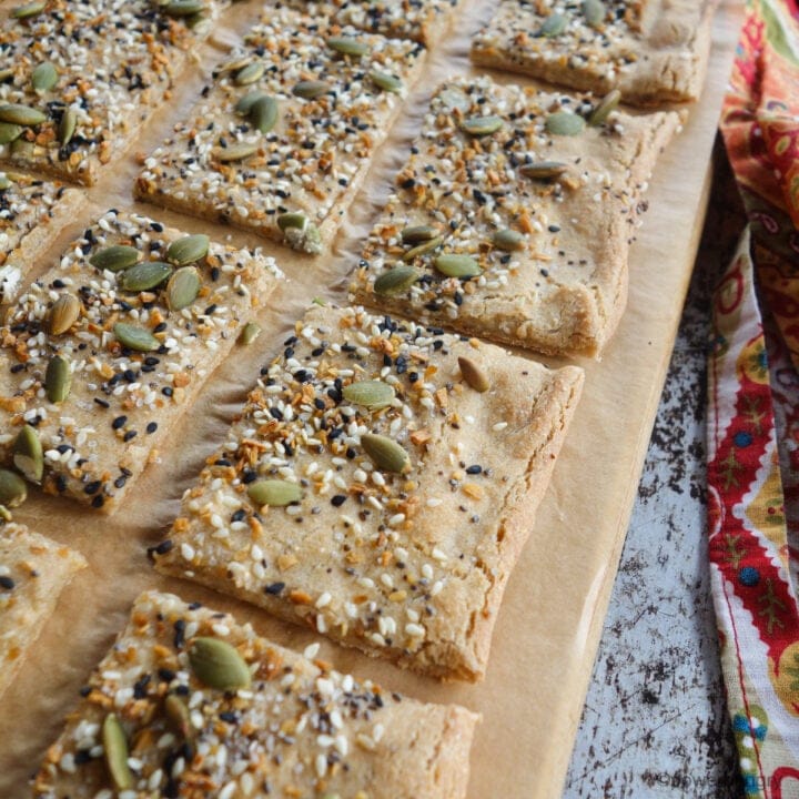 squares of amaranth flatbread on a wooden cutting board